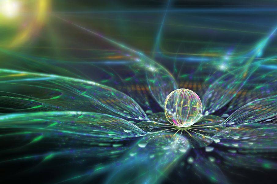glass ball sitting in the middle of glass pedals with green prism of light
